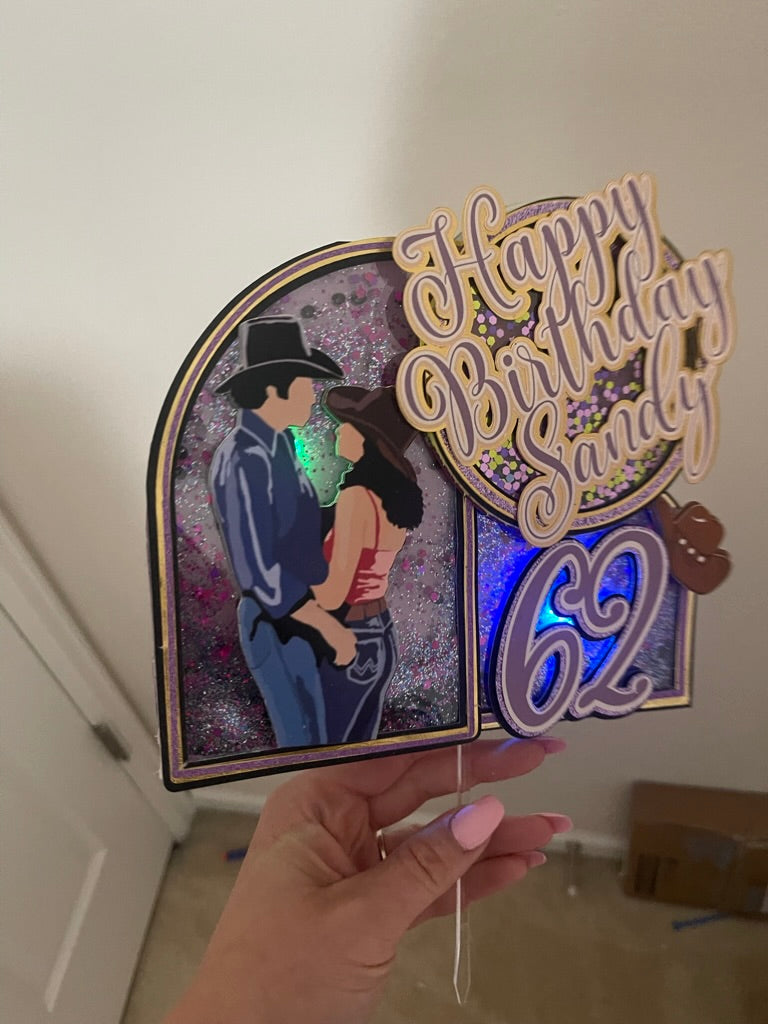 Custom urban cowboy movie theme cake topper with "Happy Birthday" in purple and gold