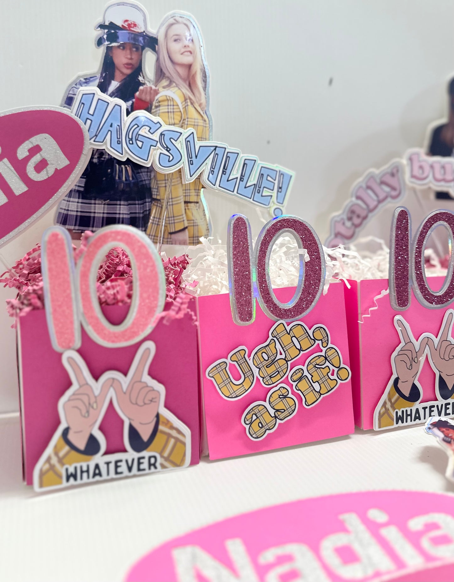 Custom centerpieces titled 'Clueless Movie 90s Theme Party Centerpieces'